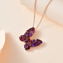 rhodolite garnet and amethyst butterfly pendant necklace in 18k rose gold over sterling silver shown in a lifestyle photo