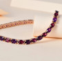 amethyst and rhodolite garnet tennis bracelet in 18k rose gold over sterling silver shown in a lifestyle photo