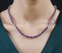 amethyst and rhodolite garnet tennis necklace in 18k rose gold over sterling silver worn around the neck