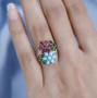 multi gemstone floral cluster ring in 18k rose gold over sterling silver shown in a lifestyle photo