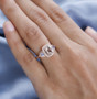morganite tanzanite and white zircon ring in 18k rose gold over sterling silver worn on a hand