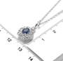 blue sapphire and white zircon lotus halo pendant necklace in rhodium over sterling silver scale