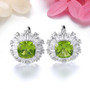 peridot and white zircon ballerina halo stud earrings in rhodium over sterling silver shown in a lifestyle photo