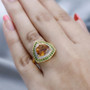 trillion citrine chrome diopside and zircon halo ring in 18k yellow gold over sterling silver worn on a hand