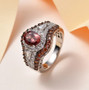 pink apatite brown zircon and white zircon ring in rhodium over sterling silver shown in a lifestyle photo