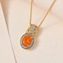 fire opal and white zircon halo filigree pendant necklace in 18k yellow gold over sterling silver shown in a lifestyle photo