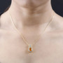 fire opal and white zircon halo filigree pendant necklace in 18k yellow gold over sterling silver worn around the neck