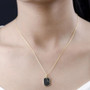 black spinel dog tag pendant necklace in black rhodium and 18k yellow gold over sterling silver worn around the neck