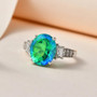 blue and green quartz triplet and white zircon ring in rhodium over sterling silver shown in a lifestyle photo