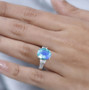 blue and green quartz triplet and white zircon ring in rhodium over sterling silver worn on a hand
