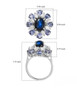 star sapphire tanzanite and moissanite halo ring in rhodium over sterling silver shown for size comparison