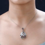 close up of multi color tourmaline and moissanite pendant necklace in rhodium over sterling silver