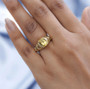 heliodor and white zircon flower ring in 18k yellow gold and rhodium over sterling silver worn on a hand
