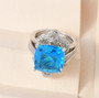 blue quartz and zircon two ring set in rhodium over sterling silver shown in a lifestyle photo