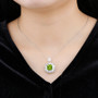 peridot and zircon halo pendant necklace in rhodium over sterling silver worn around the neck