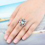 sky blue topaz citrine rhodolite garnet and zircon cluster ring in 18k yellow gold and rhodium over sterling silver worn on a hand
