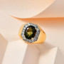 moldavite and zircon halo gents ring in 18k yellow gold over sterling silver shown in a lifestyle photo