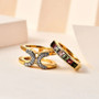 multi color tourmaline and zircon two ring set in 18k yellow gold over sterling silver shown in a lifestyle photo