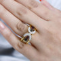 multi color tourmaline and zircon two ring set in 18k yellow gold over sterling silver worn on a hand