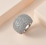 white zircon cluster wide band ring in rhodium over sterling silver shown in a lifestyle photo