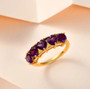 amethyst heart five stone band ring in 18k yellow gold over sterling silver shown in a lifestyle photo