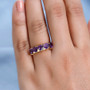 amethyst heart five stone band ring in 18k yellow gold over sterling silver worn on a hand