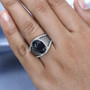 london blue topaz brown zircon and white zircon ring in rhodium over sterling silver worn on a hand