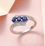 kyanite and zircon bypass ring in rhodium over sterling silver shown in a lifestyle photo