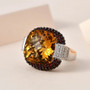 citrine garnet and zircon statement ring in rhodium over sterling silver shown in a lifestyle photo