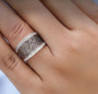 champagne diamond and white diamond wide band ring in 18k rose gold over sterling silver worn on a hand