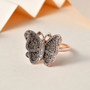 champagne and white diamond butterfly ring in 18k rose gold over sterling silver shown in a lifestyle photo