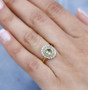 tsavorite garnet yellow sapphire and diamond halo ring in 18k yellow gold over sterling silver worn on a hand