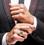 tsavorite garnet gents ring in black and white rhodium over sterling silver worn on a hand