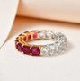 ruby and white topaz eternity band in 18k yellow gold and rhodium over sterling silver shown in a lifestyle photo