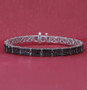 black diamond multi row tennis bracelet in black and white rhodium over sterling silver shown in a lifestyle photo