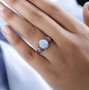 ethiopian opal champagne and white diamond ring in 18k rose gold over sterling silver worn on a hand