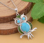 arizona sleeping beauty turquoise and chrome diopside owl pendant necklace in rhodium over sterling silver shown in a lifestyle photo