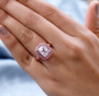 kunzite and pink sapphire ring in 18k rose gold over sterling silver worn on a hand