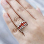 fire opal five stone ring in rhodium over sterling silver worn on a hand