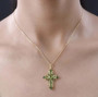 peridot and chrome diopside cross pendant necklace in 18k yellow gold over sterling silver worn around the neck