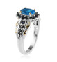 side view of neon blue apatite and sapphire ring in 18k yellow gold and rhodium over sterling silver
