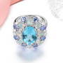 front view of sky blue topaz ethiopian opal tanzanite and zircon cluster ring in rhodium over sterling silver