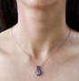 tanzanite sapphire and zircon pendant necklace in rhodium over sterling silver worn around the neck