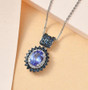 tanzanite sapphire and zircon pendant necklace in rhodium over sterling silver shown in a lifestyle photo