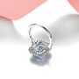 close up of sky blue topaz and white zircon double ring in rhodium over sterling silver