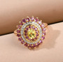 yellow tourmaline rhodolite garnet and zircon halo ring in 18k yellow gold over sterling silver shown in a lifestyle photo
