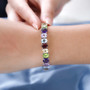 multi gemstone adjustable bracelet in rhodium over sterling silver worn on a wrist