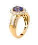 side view of tanzanite and moissanite wedding ring in 18k yellow gold over sterling silver