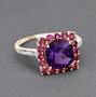 amethyst pink tourmaline and diamond halo ring in 10k yellow gold shown in a lifestyle photo