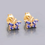 tanzanite butterfly earrings in 14k yellow gold over sterling silver shown in a lifestyle photo